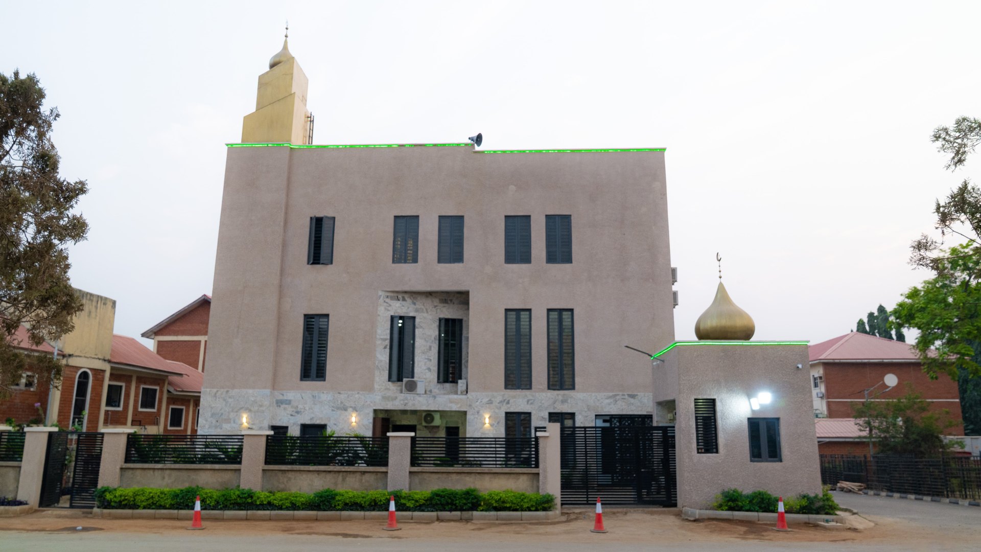 Exterior of Omar Ibn Al-Khattab Masjid, Katampe Estates, Abuja, showing the minaret and entrance
