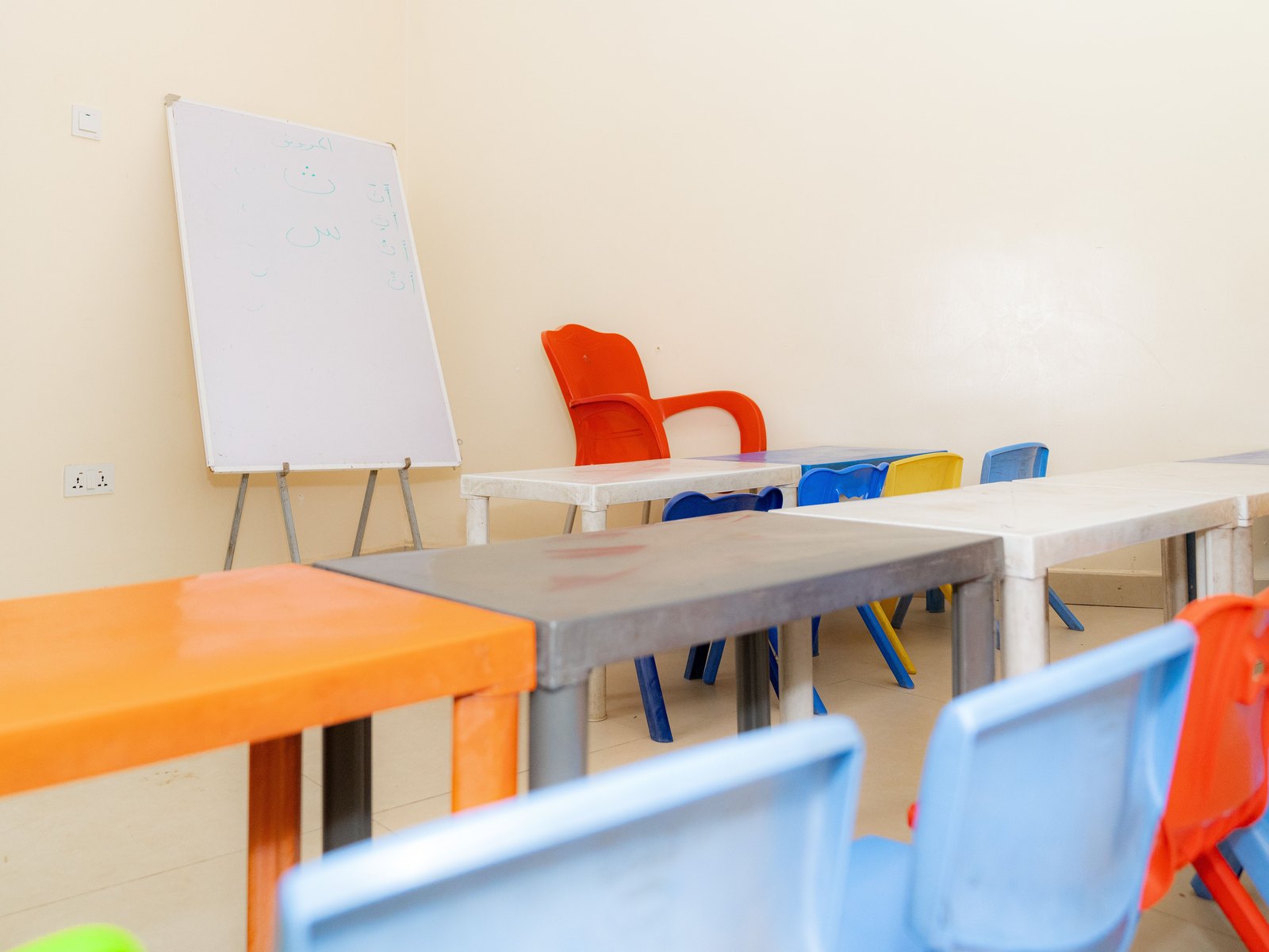 Madrasah classroom with Arabic letters on the whiteboard